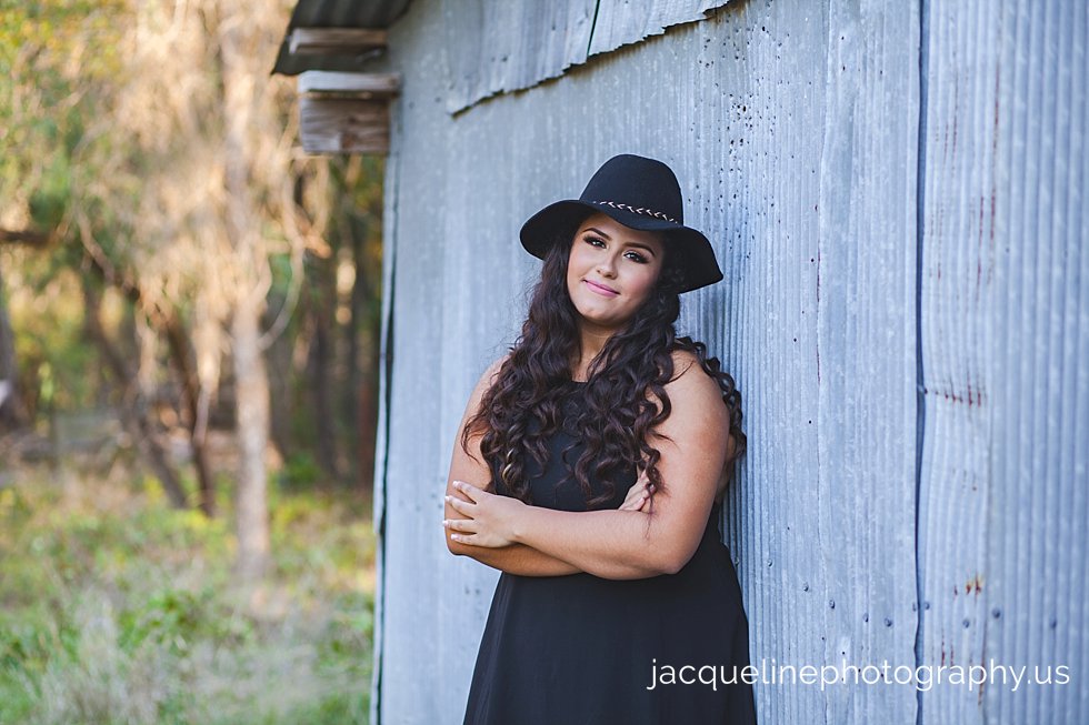 Girls with black dress celebrating her Quinceanera session in dallas TX